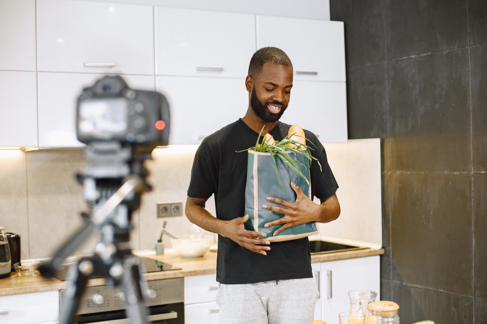 Presenter showcasing donated goods on camera